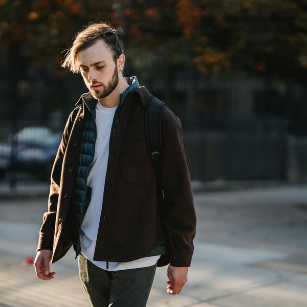 A person taking a mindful walk in a park during a sunny day.